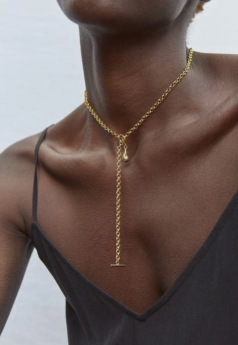 Collar con barra en T